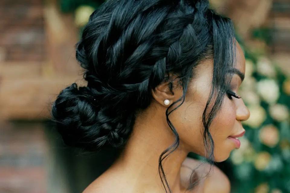 Blush Beauty wedding gallery. Close-up of female with braided updo.